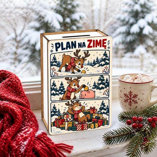 Skarbonka z komiksem „Plan na zimę” na zimowym parapecie